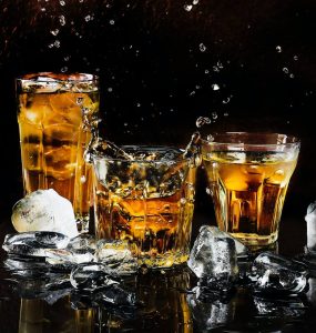 Glasses with whisky and ice